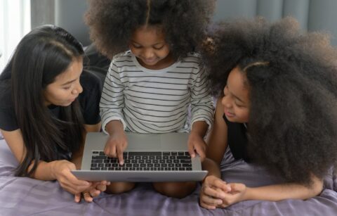 Asian-African American family Use a laptop to surf the Internet