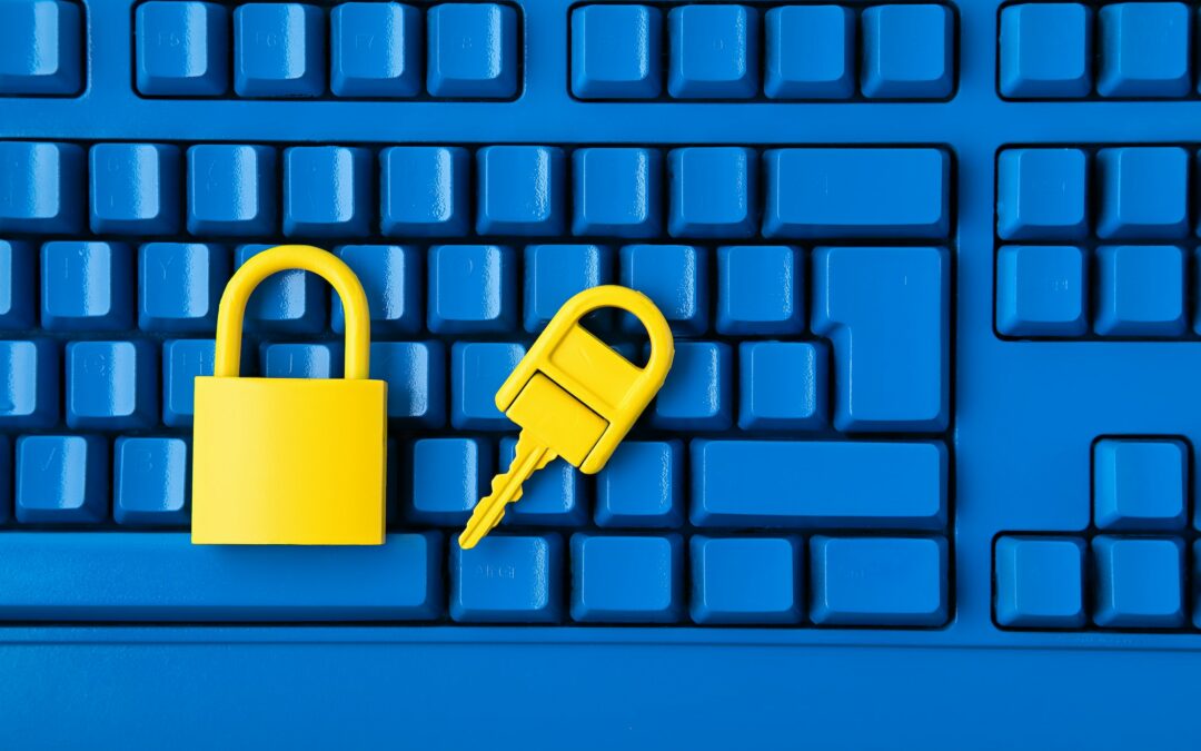 Cyber data and information security idea. Yellow padlock and key and blue keyboard. Computer